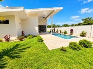 Dominical Costa Rica modern home with private pool and landscaped backyard.