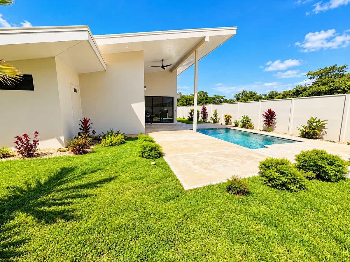 Dominical Costa Rica modern home with private pool and landscaped backyard.