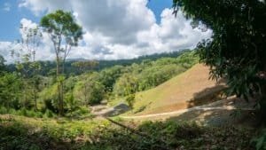 Incredible mountain view land with ocean window and dual building sites in Dominical.