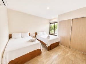 Two-bedroom condo with garden view, resort amenities, and convenient location.