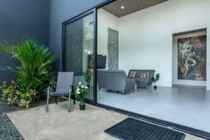 Creekside Costa Rica retreat with outdoor seating and tropical plants.
