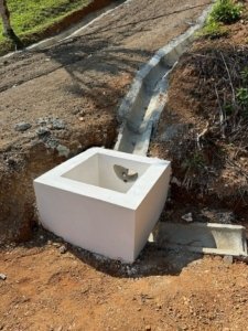 Water connection and drainage system on mountain land in Dominical, Costa Rica.