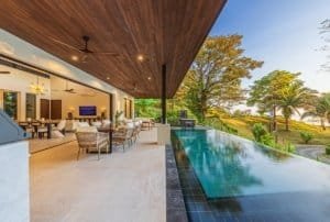 Ocean view infinity pool and covered terrace at luxury villa in Dominical, Costa Rica.