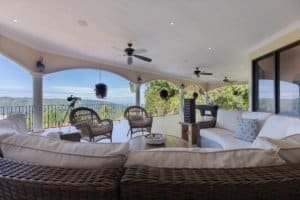 Spacious balcony with outdoor seating and mountain view in Costa Rica.