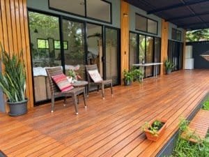 Beautiful wooden deck with outdoor seating and lush greenery in Dominical.