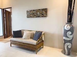 Elegant living room with modern decor and large vase in Costa Rica.