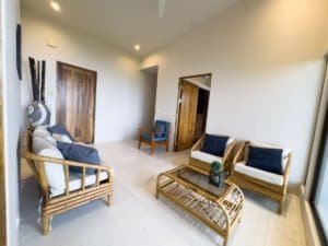 Bright living room with rattan furniture and ocean view in Dominical.