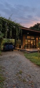 Modern tropical home with pool and lush garden near Dominical beach.