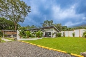 Turnkey Costa Rica villa property with multiple units and lush lawn.