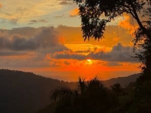 Beautiful sunset over mountains and ocean in Dominical Costa Rica.
