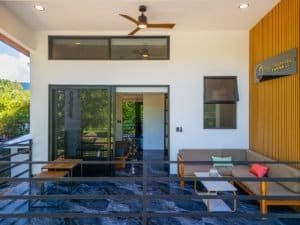 Ocean view condo deck with seating and modern decor in Dominical Costa Rica.