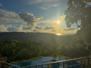 Scenic view of ocean, mountains, and sunset from luxury home in Dominical.