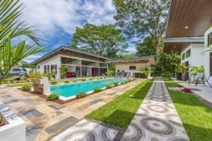 Turnkey 5-bedroom investment villa with pool and modern outdoor lounge in Dominical estate.