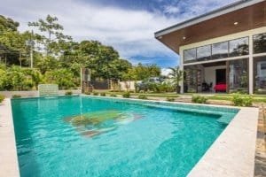 Turnkey Costa Rica villa with private pool and modern glass-walled living space.