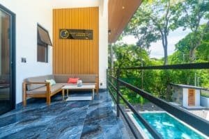 Dominical Costa Rica condo terrace with seating and pool view.