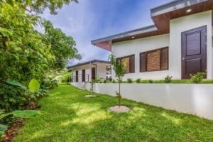 Turnkey investment villa complex in Dominical with multiple homes and lush landscaping.