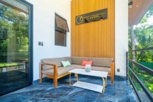 Ocean view condo terrace with seating and resort amenities in Dominical.