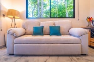 Dominical Costa Rica living room with beige sofa and turquoise pillows.