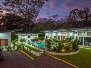 Turnkey Costa Rica retreat with 3 villas, 2-bedroom home, pool and tropical landscaping.