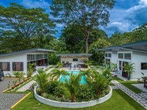 Dominical real estate: resort-style villas with pool and lush landscaping.