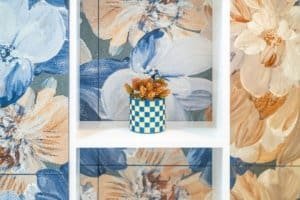 Ocean view condo decor with blue and beige floral tiles and a blue checker pot.