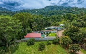 Turnkey 3 rental villas and 2-bedroom home with pool in lush Costa Rica hillside.