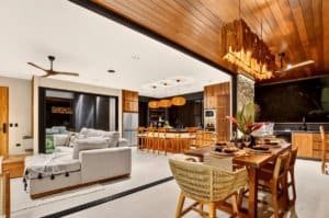 Open-plan living area with dining and kitchen in a tropical Costa Rica home.