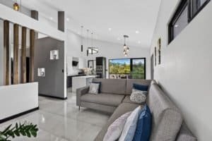 Bright modern living room with mountain views, stylish decor, and open layout.