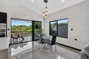 Bright dining area with mountain views and sliding glass doors.