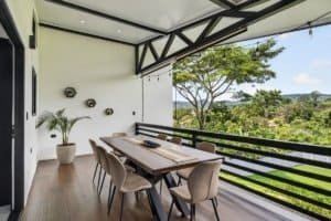 Balcony with dining table and mountain view in Dominical Costa Rica.
