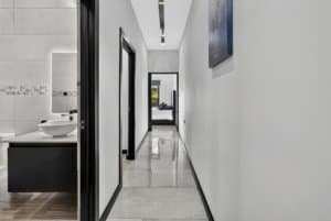 Bright hallway with white walls and modern decor in Dominical.
