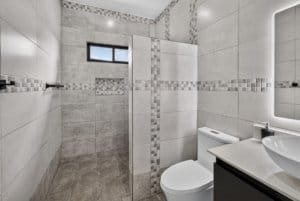 Contemporary bathroom with walk-in shower and modern fixtures.