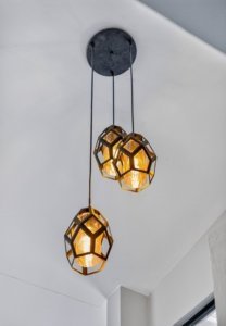 Contemporary pendant light with geometric design in modern home interior.