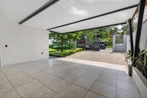 Spacious covered carport area with mountain views and modern design in Dominical.