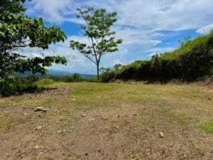 Open land with trees and ocean view in Dominical, Costa Rica.