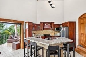 Open kitchen with granite counters and mountain view in Dominical.