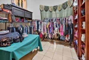 Large closet filled with clothes, shelves, and storage in Dominical.