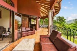 Balcony with seating and mountain views in Dominical Costa Rica.